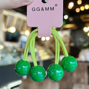 Colorful high-elastic hair tie with bright green beads and soft yellow elastic band