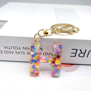 Letter H resin keychain with colorful heart sequins and golden lobster clasp
