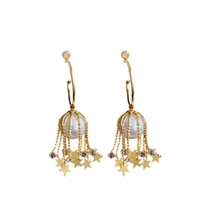Star tassel C-shaped gold pearl earrings with crystal accents on a white background
