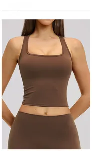 Detail of chocolate brown sports vest and high-waist leggings in matte functional fabric