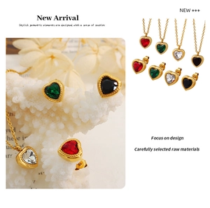 Detail of heart jewelry set featuring gold plated necklaces and stud earrings in four colors