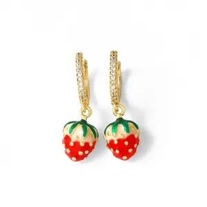 Detail of strawberry drop earrings with gold plating and sparkling zircon pavé setting