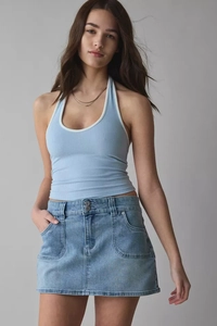 Detail of high-waist denim skirt paired with a light blue ribbed halter top in summer style