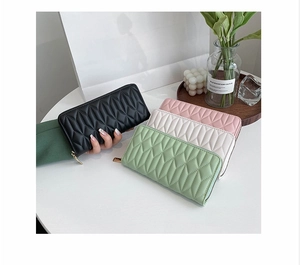 Quilted long wallets for women in black, pink, white, and green with U-shaped zip closure