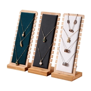 Bamboo wood necklace display stand with three-color leather pads for jewelry presentation