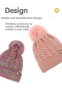 Detail of colorful and pink knit beanies with decorative pom-poms and leather logo patch