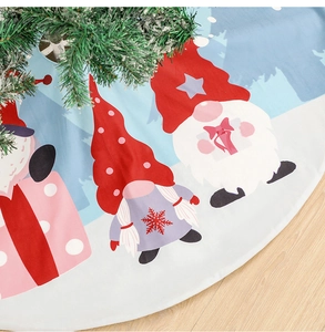 Detail of white Christmas tree skirt featuring three festive gnomes and snowflake prints
