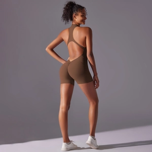 Back view of brown seamless romper featuring cross straps and scrunch butt lifting detail