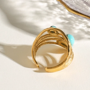 Bohemian gold stainless steel open ring featuring two round turquoise blue stones