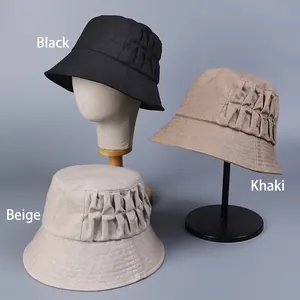 Elegant linen sun hats for women featuring pleated side design in black, beige, and khaki