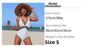 Detail of white deep V-neck swimsuit featuring ethnic style embroidery and beach resort vibe