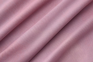 Macro shot of soft lavender mesh fabric texture with subtle folds and fine mesh pattern detail