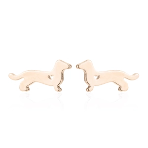 Detailed close-up of golden dachshund stud earrings with a hollow heart cutout design