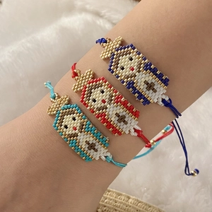 Bracciale di perline fatto a mano con motivo Vergine Maria e personaggio dei cartoni