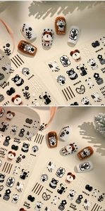 Detailed view of minimalist nail stickers with cute cartoon animal and cactus patterns