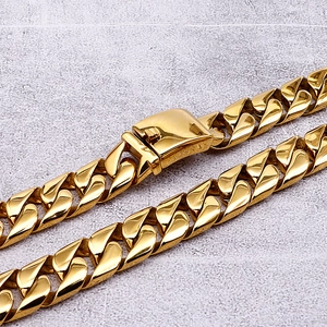 Detailed macro view of 18K gold plated stainless steel Cuban link chain with box clasp