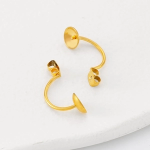 Macro view of gold plated stainless steel cup and peg C-shaped stud earring findings
