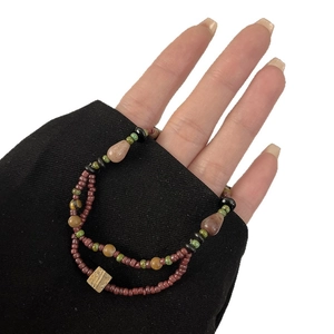 Double-layer brown glass bead bracelet with square wooden bead on model wrist