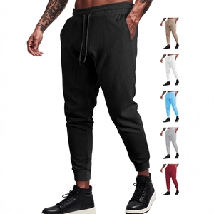 Men's waffle knit jogger pants with drawstring waist shown in six assorted colors