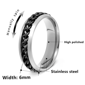 Detail of 6mm stainless steel spinner ring with a black rotatable chain and polished finish