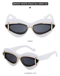Front and side view of white cat-eye sunglasses with gold metal accents and gray lenses