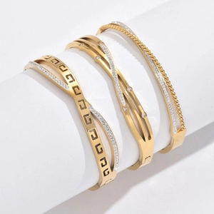 Three-piece gold stainless steel cuff bracelets with crystals and Greek key design