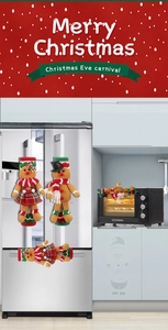 Detail of Christmas gingerbread man fridge handle covers in red and green festive cloth