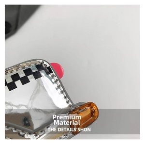 Detail of silver mirror texture bag with checkerboard pattern and quality stitching