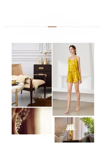 Detailed view of yellow satin pajamas set featuring V-neck camisole and ruffled hem shorts