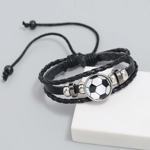 Detail of multi-layer black braided leather football charm bracelet with adjustable cords