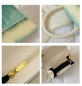 Detail view of colorful gradient leather handbag with golden hardware and spacious interior