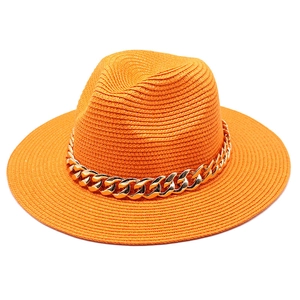 Orange straw jazz hat with chunky gold chain decoration for sun protection