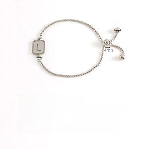 Detail view of silver stainless steel letter L charm bracelet with size measurements