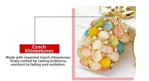 Macro detail showing colorful cat eye stones and Czech rhinestones on pineapple charm