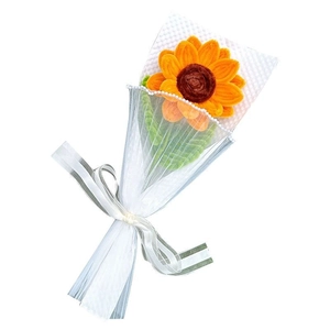 Handmade crochet sunflower bouquet with yellow petals and green leaves in white mesh wrap