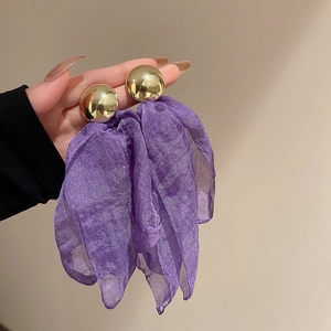 Detailed close-up of French vintage purple tulle earrings with golden pearls and silver pins