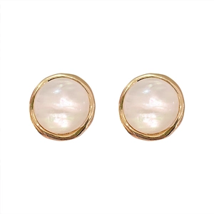 Minimalist round resin earrings with gold frame and iridescent shell inlay on white backdrop