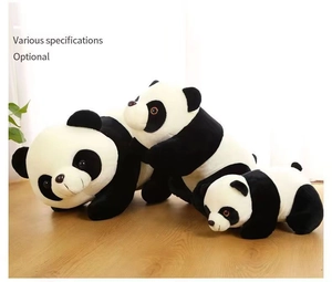 Three sizes of realistic plush panda dolls in a prone position on a wooden floor