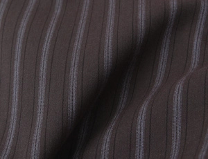Macro shot of dark brown pinstripe fabric texture with blue and white vertical stripes
