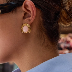 18K gold plated stainless steel ribbed earrings with natural pink quartz stone on model