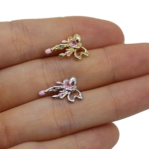 Minimalist tiny bow tie cartilage earrings in gold and silver with pink heart stones