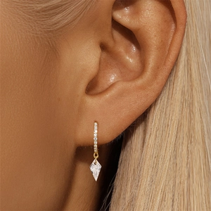 Close-up of elegant gold plated S925 sterling silver hoop earrings with diamond rectangle charms