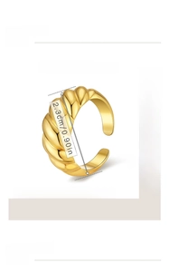 Detail shot of golden croissant ring showing dimensions 2.3cm and 3.9g weight