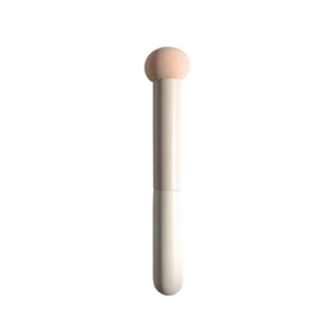 Mushroom head concealer brush with round beige sponge tip and lid for smooth makeup finish