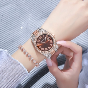 Luxury rose gold and silver watch with crystal bezel and matching heart bracelet
