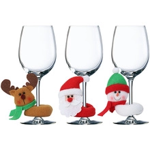 Plush Christmas wine glass charms featuring reindeer, Santa Claus and snowman design