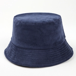 Detailed view of a navy blue corduroy bucket hat with a minimalist solid color design.