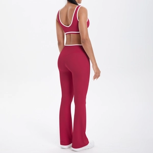 Detail of high-waist flared yoga pants with contrast white piping and brushed fabric