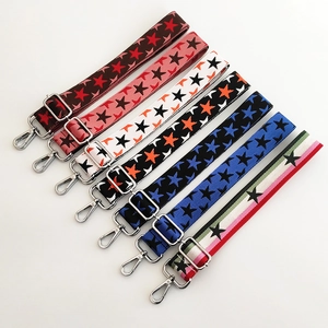 Adjustable knit bag strap with colorful star patterns and polished silver metal clips