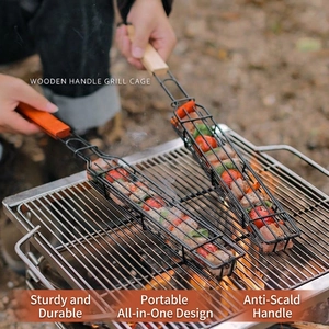 Outdoor grill cage with wooden handle for meat and vegetables on a charcoal campfire